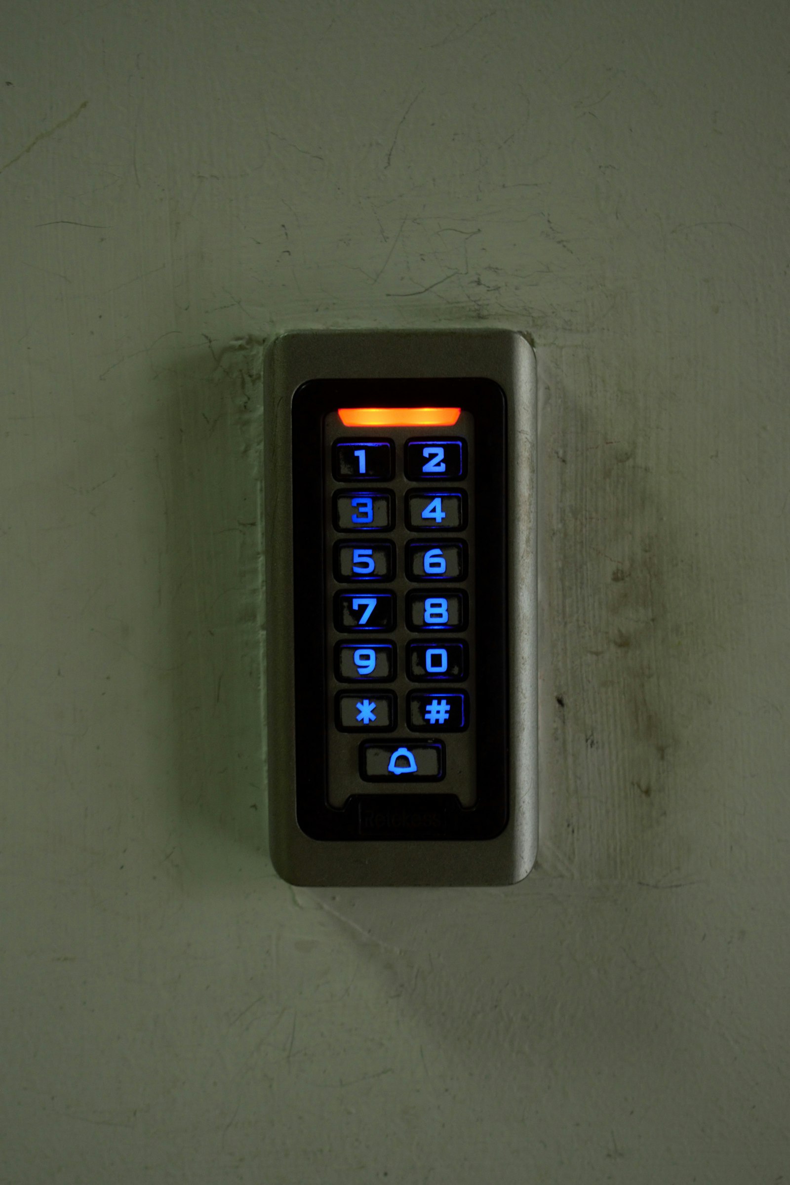 Intruder alarm keypad on wall